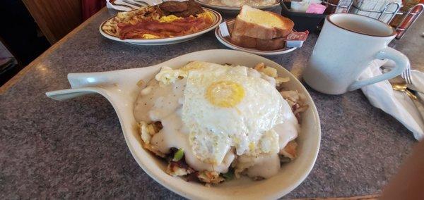 Country fried steak skillet with homemade toast.