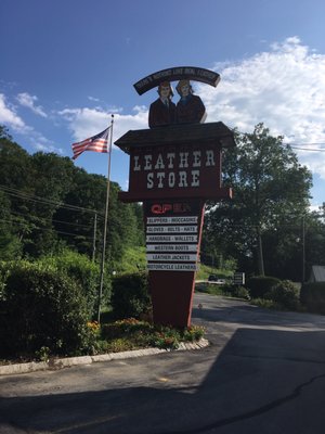 Leather Store road sign.