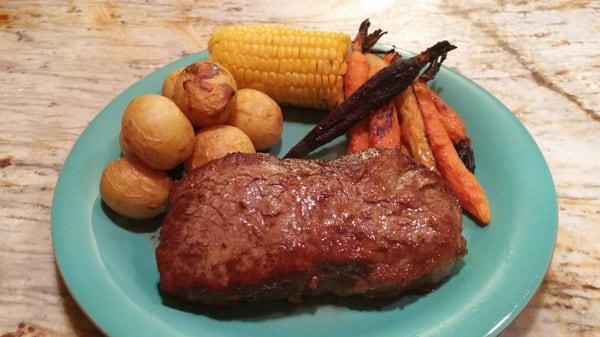 NY Strip marinated in Jessi's Flaming Fruit Sauce Original with roasted potatoes and Jessi's Flaming Fruit Sauce Apricot glazed carrots.