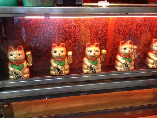 Waving cats