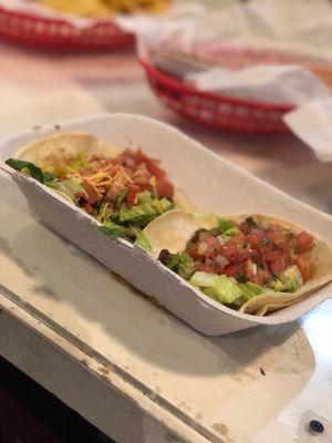 Buffalo jackfruit taco and black bean and cheese taco