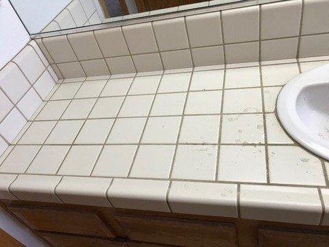 Bathroom sink tile counter top before Maverick Chemdry cleaning service.