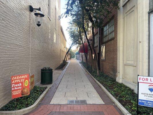 We are located in this alley. Alley next next to Olympia candy kitchen.