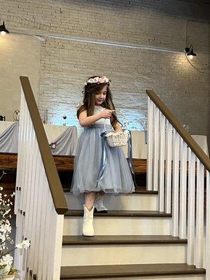 Flower girl descends from the stage