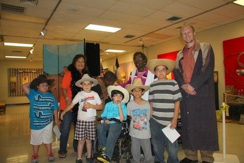 Snyder Life Skills class and Museum Director Daniel posing during our Texas Justice Exhibit