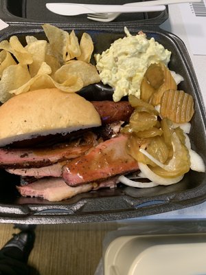 2 meat combo, brisket sausage with chips and potato salad. Onions and pickles