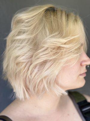 Short bob haircut. Ashy blonde color with a root-tap.