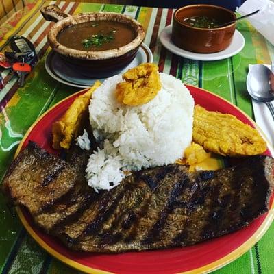 Steak, rice, beans, and tostones