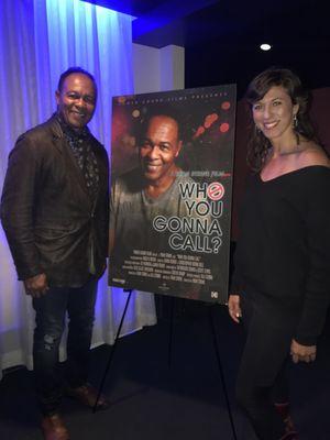 Picture of Lisa with Grammy Award-Winning Ray Parker, Jr., standing with the movie poster that she photographed him for.