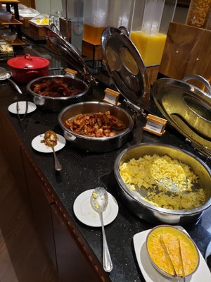 Eggs, bacon, potatoes, oatmeal, bread assortment