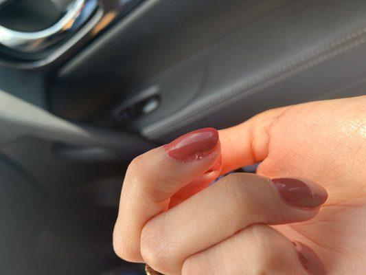 Middle finger nail where polish is lifted