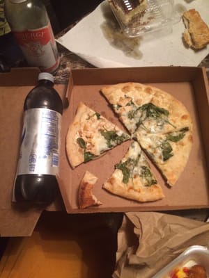 Chicken Alfredo pizza with added spinach. Small. I put the Pepsi next to it for scale.