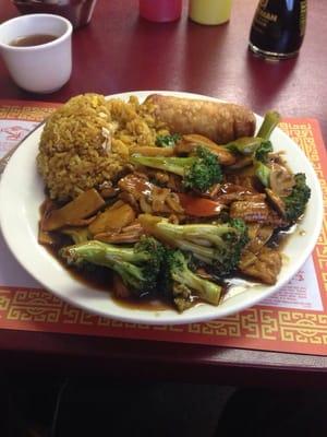 Broccoli chicken, lunch size with fries rice and egg roll.