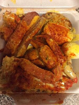 The combination snowcrab tray includes 2 clusters, shrimp, potato, corn, sausage and egg.