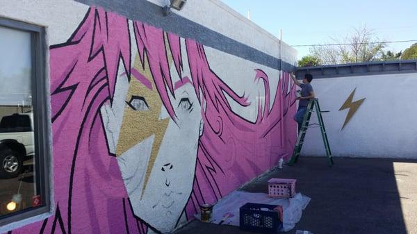 Paul working on the mural