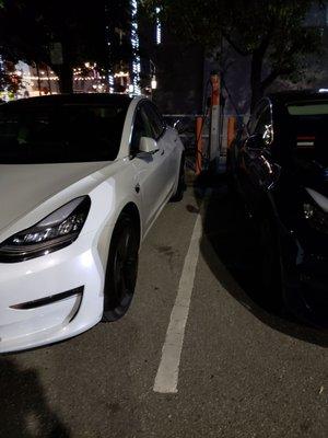 EV charging in the back lot. $1 per hour.