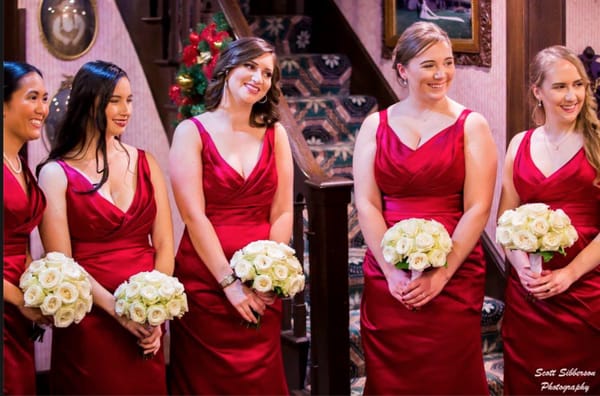 Bridesmaids flowers: 18 white roses hand tied.