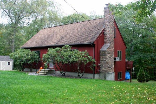 Cathedral Ceiling, Exposed Wood Beams. Field Stone Fireplace with Jotul Wood Burning Insert in the Living Room are just a few...