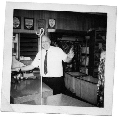 Second generation owner Louis Feigenbaum greeting a customer at the counter. "If you do something, do it right!"