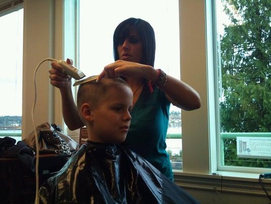 Jen Lucero working on a clipper cut