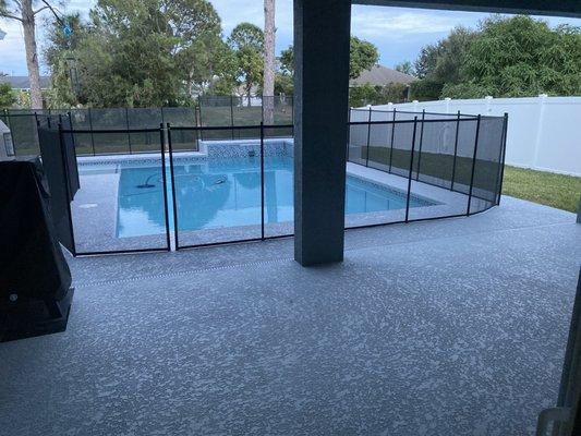 Our pool. One of our pugs is mostly blind so we keep a safety fence up!