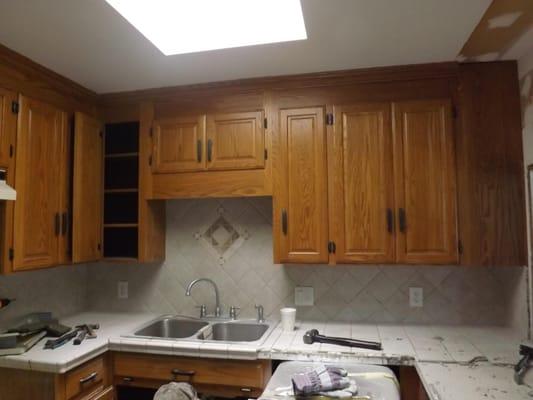 before we started the cabinets  we had to bust up the tile floors and the counter tops.