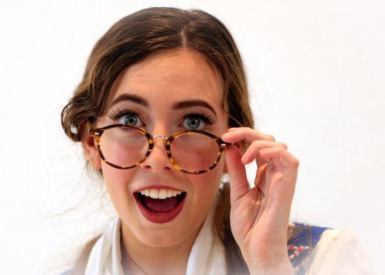 Belle wearing glasses during photoshoot