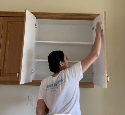 Scrubbing kitchen cabinets