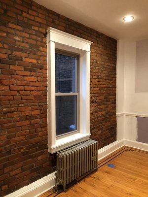 Repaired and exposed brick wall