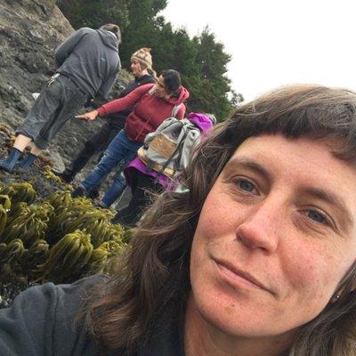 Michelle teaching a seaweed harvesting class on the coast