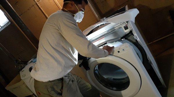 Taking apart Samsung dryer to examine why it won't run heated air.