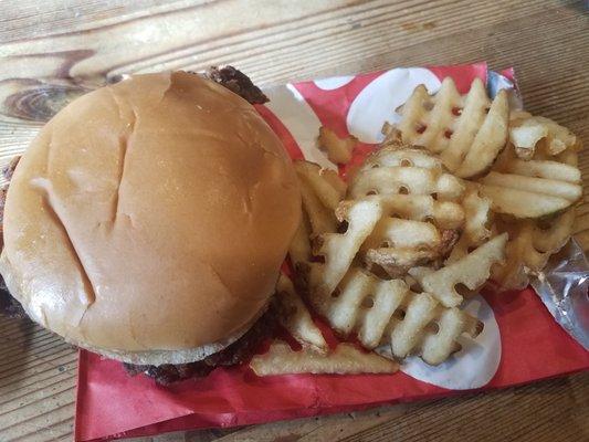 spicy sandwich and half of the waffle fries