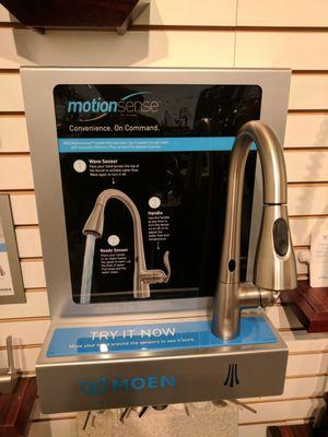 Several models of touchless faucets on display