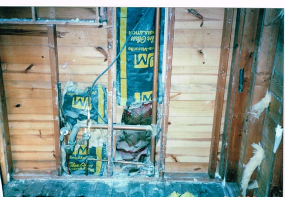 Bare studs of a powder room renovation