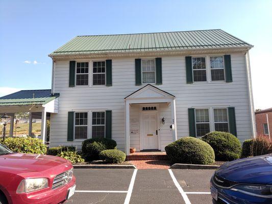 The front of our building on a sunny day. Plenty of parking in the front and in the back.