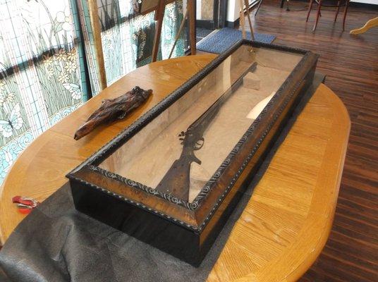 Guncase shadowbox can be hung or displayed on flat surface.