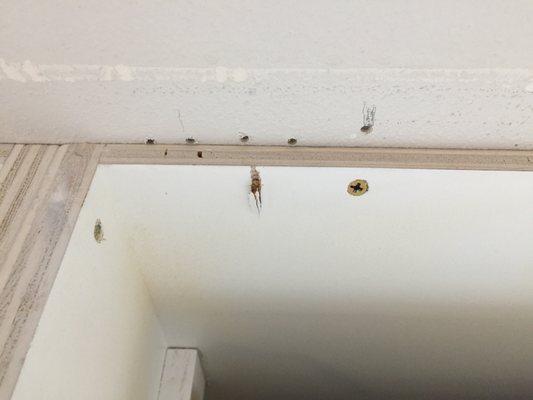 After the plywood was removed you can see the screws were out in crooked and split the cabinet wall.  These are customer cabinets.