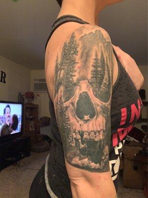 Skull mountain tattoo