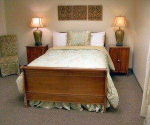 Private, comfortable rooms with full-size beds, private bathrooms, and HD flatscreen televisions.