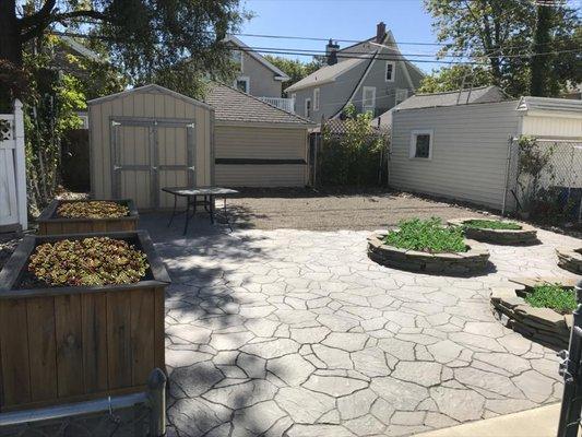 Irregular pavers and circular garden beds