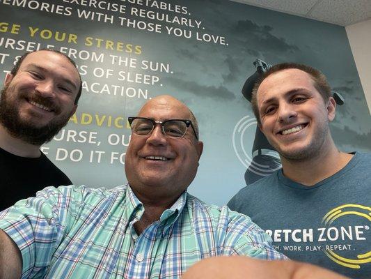 Brian Benge, Stretch Practitioner/Manager, Tony L, Nick Vankleeck, General Manager/Stretch Practitioner, in the reception area.