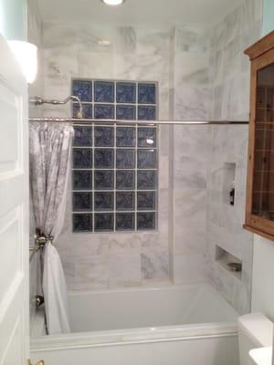 Beautiful soaking tub and Carrara marble from floor to ceiling