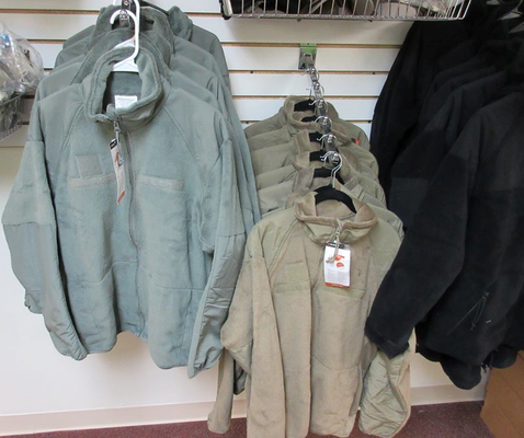 Military Surplus OGSI fleece jackets in green, khaki, and black