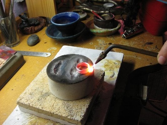 Melting the metal to make an ingot