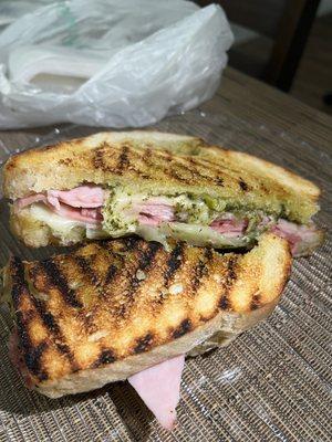 Customized Italian meat with pesto and cheese on a sourdough grilled panini. So good!