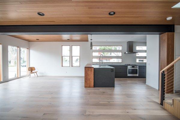 Exposed structural steel with oak flooring and T&G vertical grain fir ceiling.