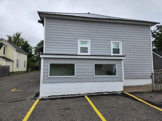 Plenty of off-street parking for Happy Feet Massage to the rear, and side of the building.