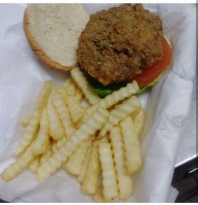 Shrimp Burger chunks of Shrimp seasoned to perfection molded in to a burger fried and served on a bun with Lettuce and Tomato.