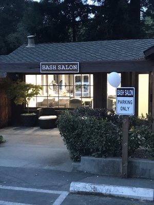 Front entrance of the salon with dedicated parking spots for customers only