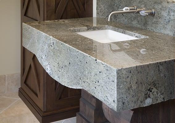 Uniquely designed bathromm granite countertop with mitered apron.  See our website for more information www.sfistone.com